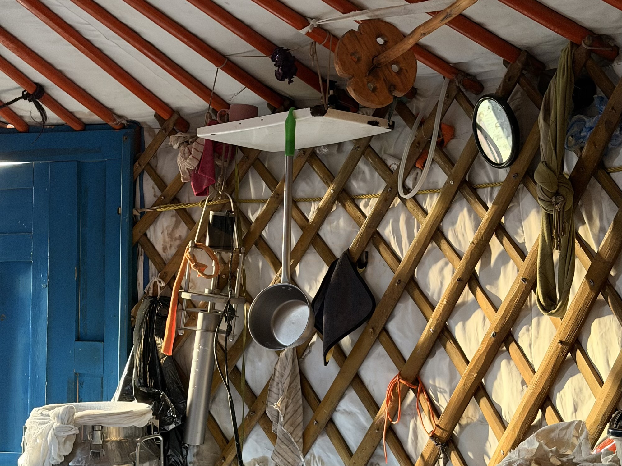 Chuluunbaatar racehorse trainer camp: The everyday tools used for making Airag and processing fresh milk, hanging along the ger wall. (Dairy tools)
