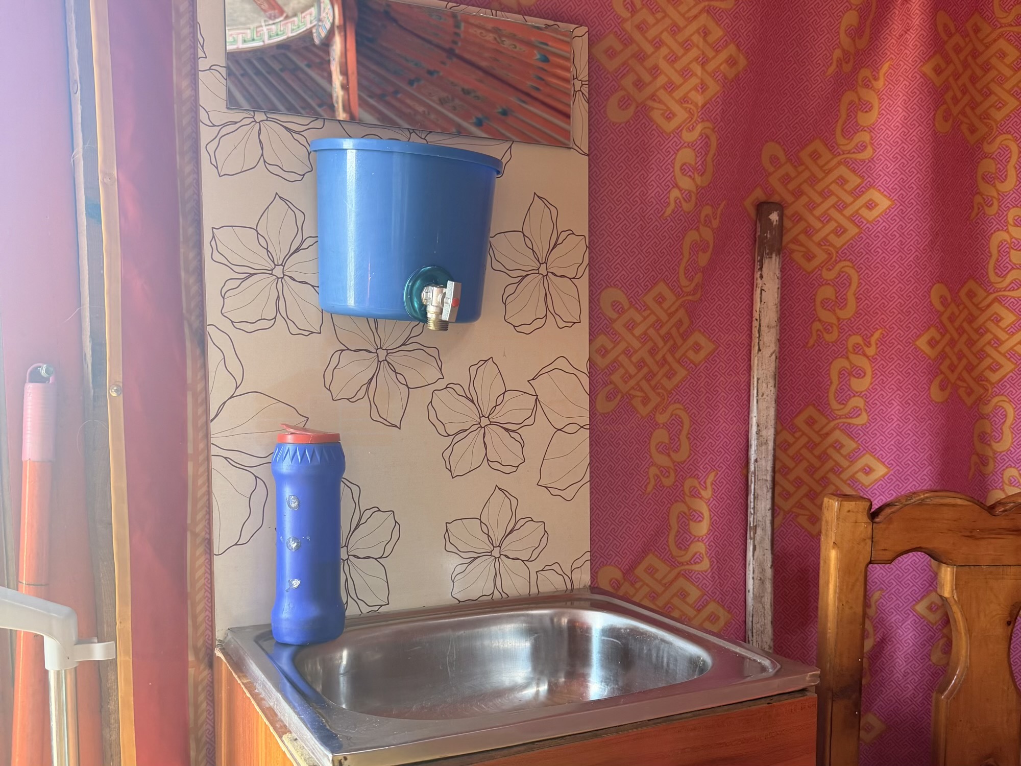 Gavalmaa volcano camp: We maintain a clean, organized camp. A dedicated handwashing station with clean water is provided inside the ger. (Interior, Hygiene, Amenities)
