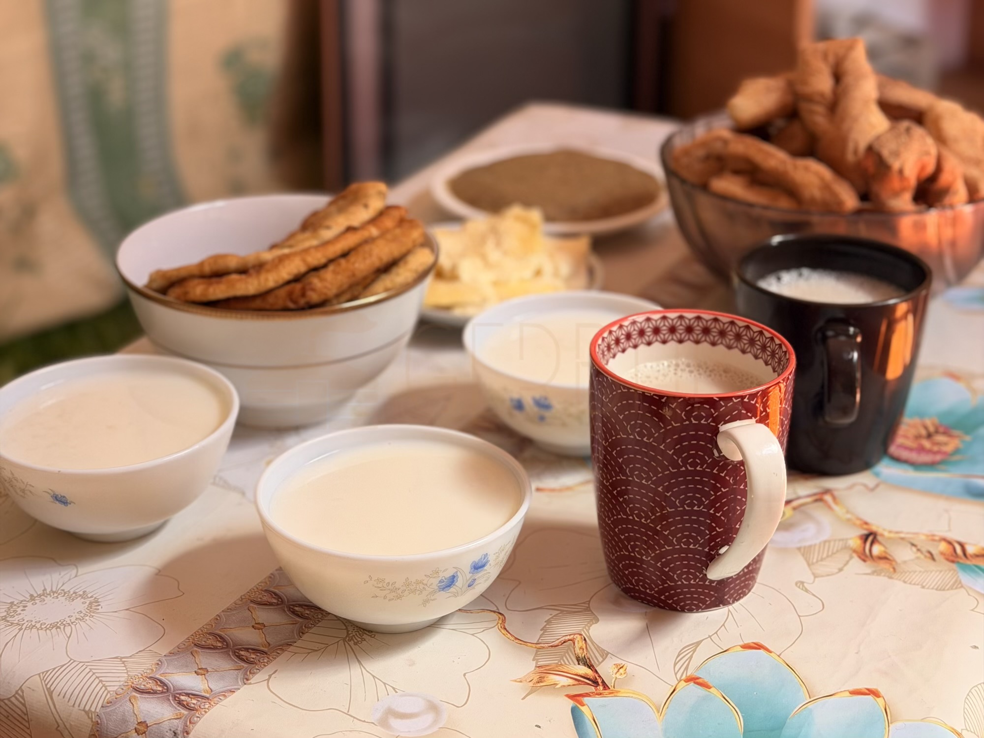 Batzaya camp: A proper nomad breakfast. We serve fresh Urum, warm boortsog (fried dough), hailmag (sweetened clotted cream), and plenty of suutei tsai. (Food, Traditional Breakfast, Dairy)