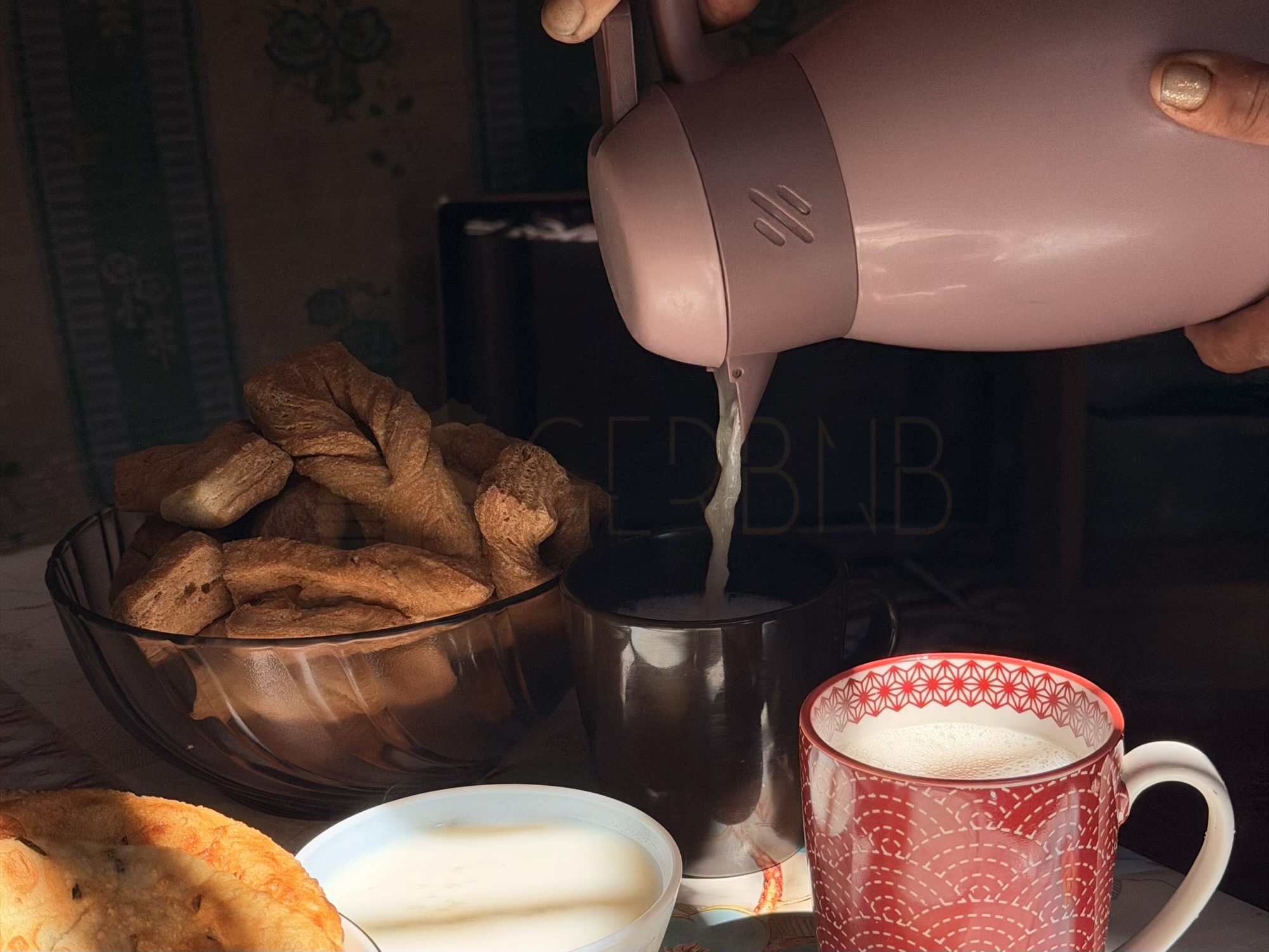 Batzaya camp: Pouring fresh, hot suutei tsai (Mongolian milk tea). It is the daily fuel of the steppe, and we always keep a fresh pot ready for guests. (Food Preparation, Milk Tea, Traditional Drink)