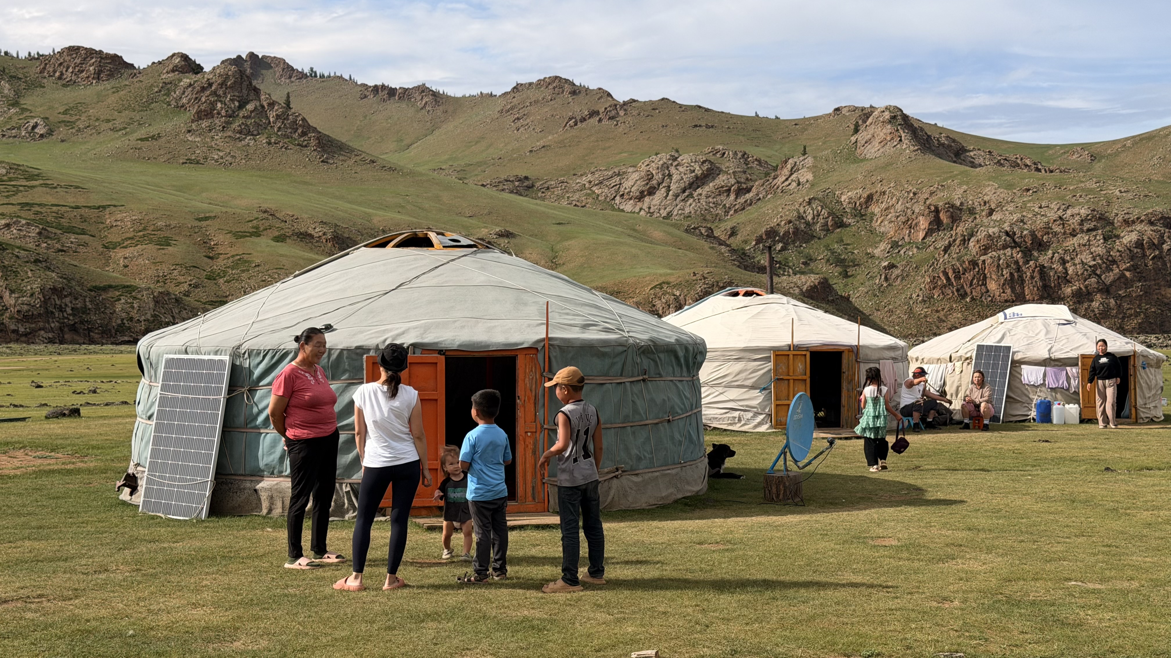 Tsedenlham Orkhon waterfall camp: The family gathers in front of the gers, with the Orkhon River running just behind the camp. (Family, camp front)