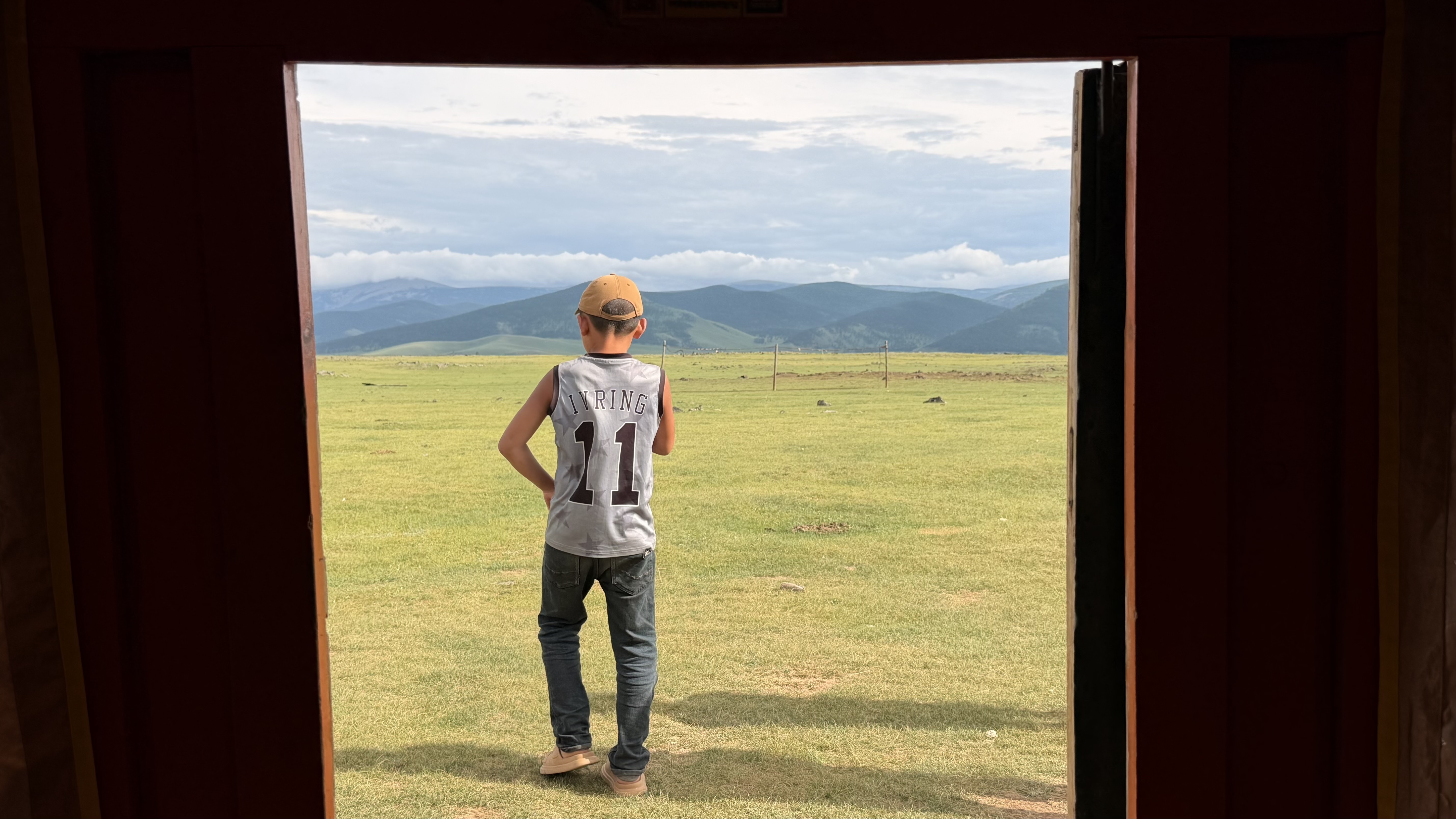 Tsedenlham Orkhon waterfall camp: Stepping out the door looks straight into the Orkhon Valley — a stretch of volcanic ground framed by two rivers and mountain chains near the Orkhon Waterfall. (Doorway view, Orkhon Valley)